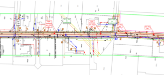 Zdjęcie przedstawia szczegółowy, kolorowy plan techniczny infrastruktury miejskiej z licznymi liniami, symbolami i adnotacjami.