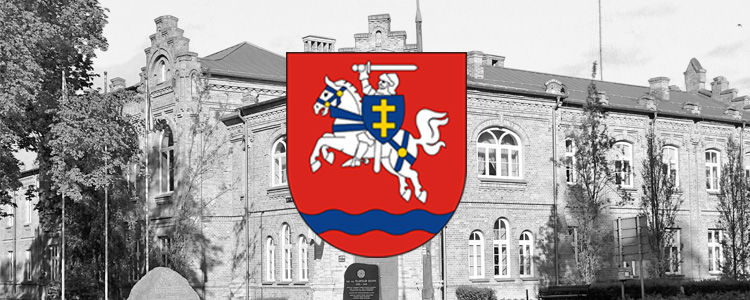 Grafika przedstawia herb powiatu. W drugim planie widoczny budynek Starostwa Powiatowego w Puławach.