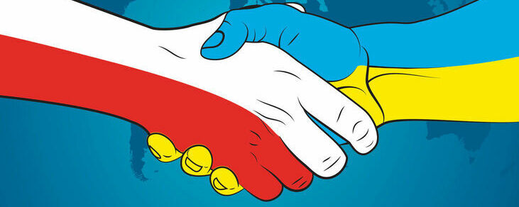 Złączone dłonie w barwach Polski i Ukrainy